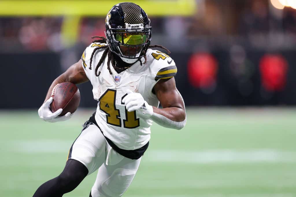 Alvin Kamara #41 of the New Orleans Saints runs with the ball after a reception in the first quarter of the game against the Atlanta Falcons at Mercedes-Benz Stadium on November 26, 2023 in Atlanta, Georgia.