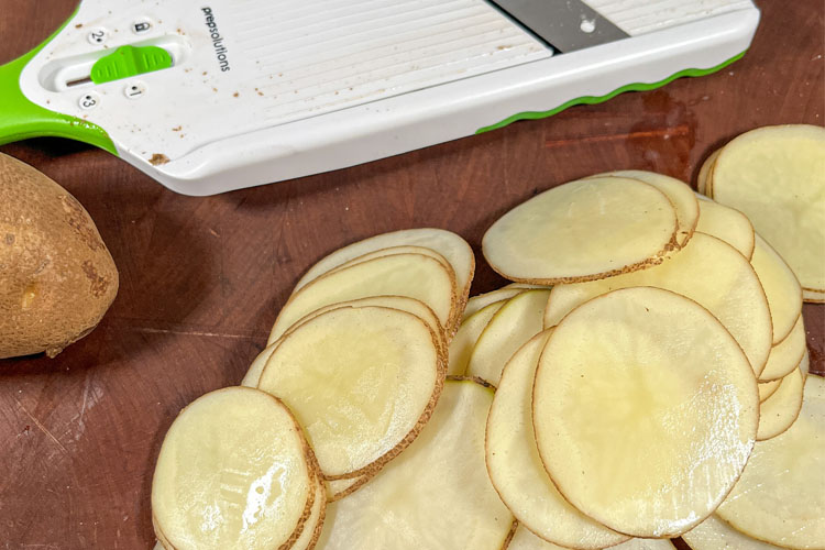 sliced potatoes and a mandolin