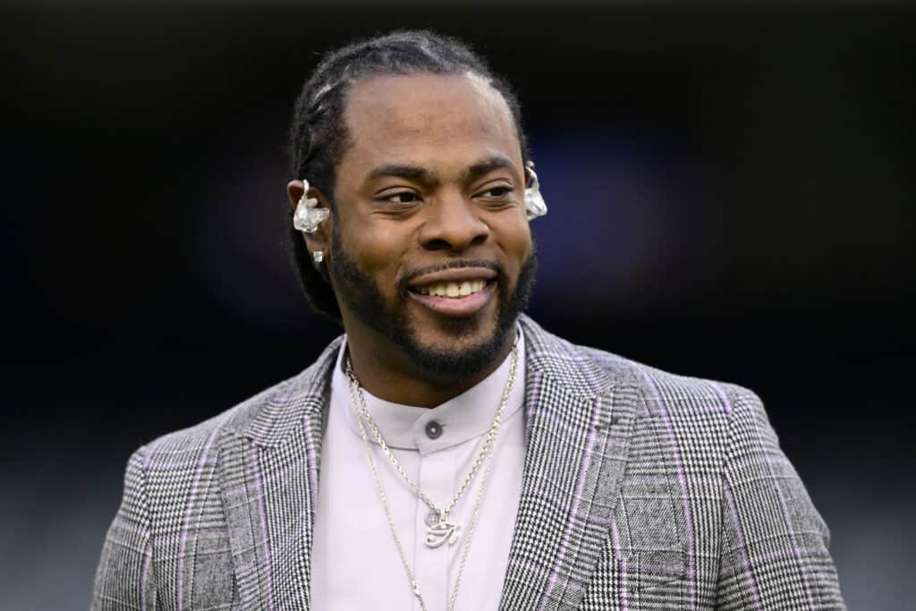 Former NFL player and Thursday Night Football broadcaster Richard Sherman looks on before the game between the Chicago Bears and the Washington Commanders at Soldier Field on October 13, 2022 in Chicago, Illinois.