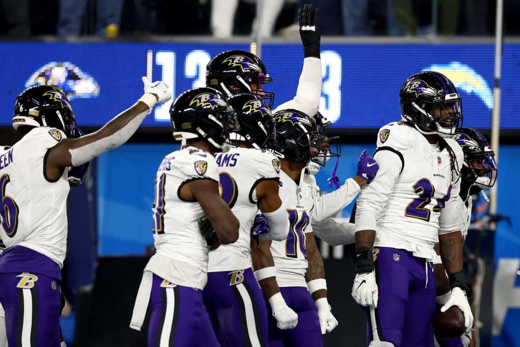 Jadeveon Clowney #24 of the Baltimore Ravens celebrates with his teammates after recovering a fumble against the Los Angeles Chargers during the fourth quarter in the game at SoFi Stadium on November 26, 2023 in Inglewood, California.