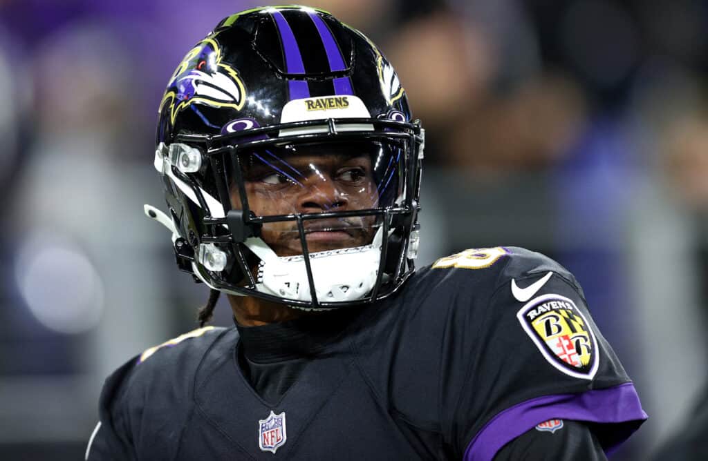 Lamar Jackson #8 of the Baltimore Ravens warms up during a game against the Cleveland Browns at M&T Bank Stadium on November 28, 2021 in Baltimore, Maryland.