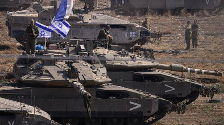 Israeli tanks and armored vehicles are deployed near the Gaza border in October, days after the country's war with Hamas broke out.