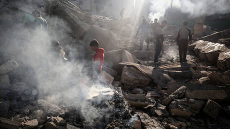 Palestinians inspect debris at the Jaffa Mosque after an Israeli bombardment on Friday in Gaza.