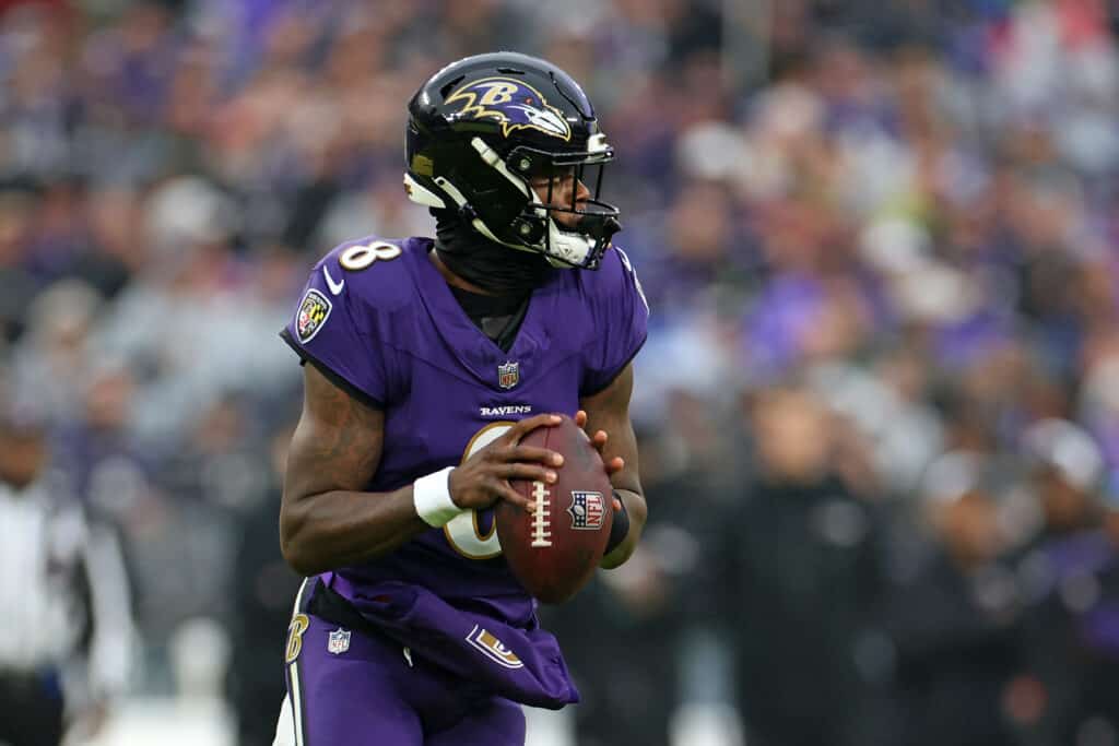 BALTIMORE, MARYLAND - DECEMBER 10: Lamar Jackson #8 of the Baltimore Ravens drops back to pass during the second quarter in the game against the Los Angeles Rams at M&T Bank Stadium on December 10, 2023 in Baltimore, Maryland.