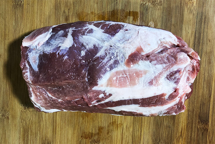 uncooked pork butt with fat cap trimmed off