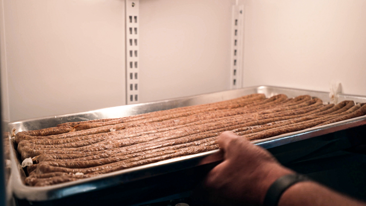 snack sticks curing in the fridge