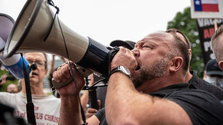 Infowars founder Alex Jones speaks into a bullhorn at the Texas State Capital building on April 18, 2020 in Austin, Texas