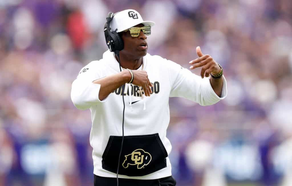 Head coach Deion Sanders of the Colorado Buffaloes calls a play against the TCU Horned Frogs during the first half at Amon G. Carter Stadium on September 2, 2023 in Fort Worth, Texas.