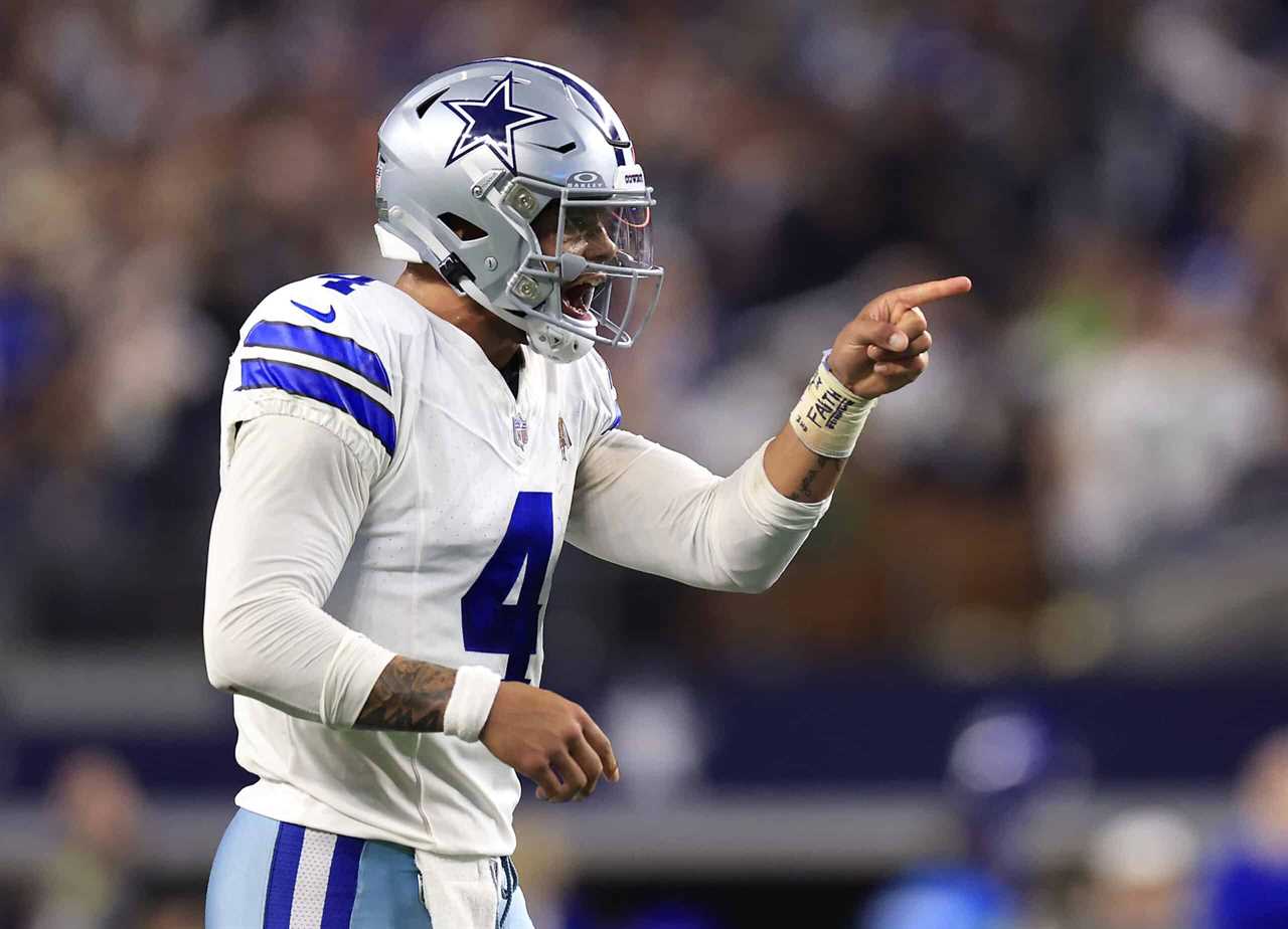 ARLINGTON, TEXAS - NOVEMBER 30: Quarterback Dak Prescott #4 of the Dallas Cowboys celebrates after a two-point conversion during the 4th quarter of the game against the Seattle Seahawks at AT&T Stadium on November 30, 2023 in Arlington, Texas.
