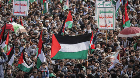 FILE PHOTO. Yemeni protesters wave Palestinian flags during a protest in solidarity with the residents of Gaza