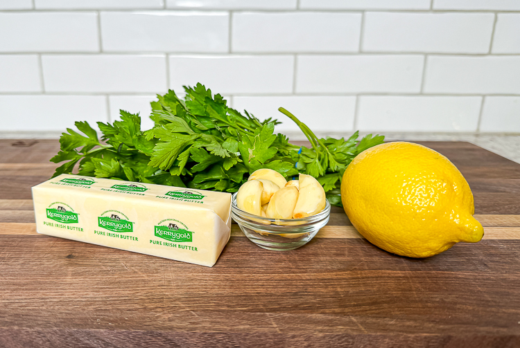 compound butter ingredients on a wooden board