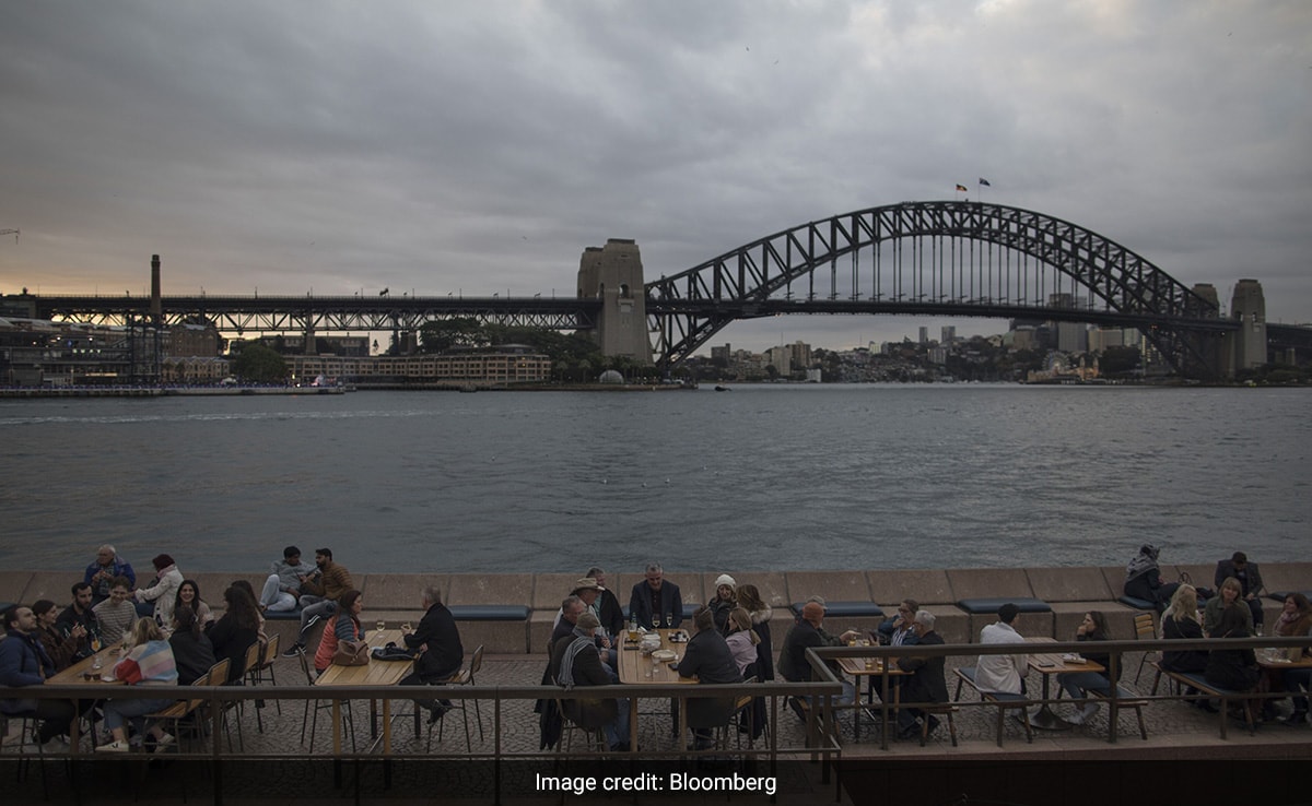 Diners at a restaurant near Sydney Harbour Bridge.