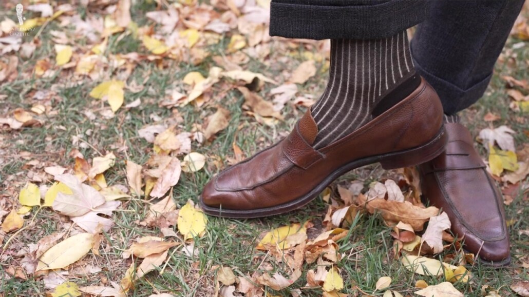 Slim fit trousers wouldn't allow you to wear over-the-calf socks.