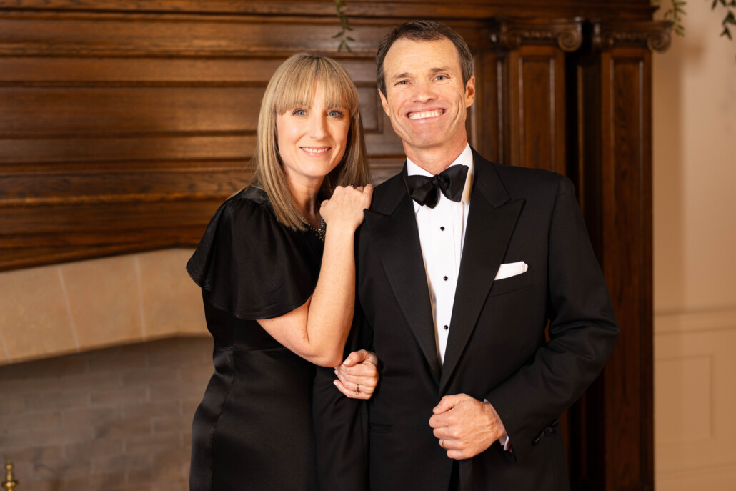 Photo of a woman and a man with a drooping butterfly bow tie 