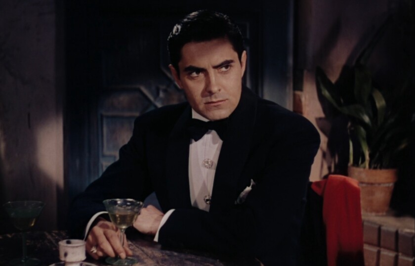 Film still of a man wearing crystal studs