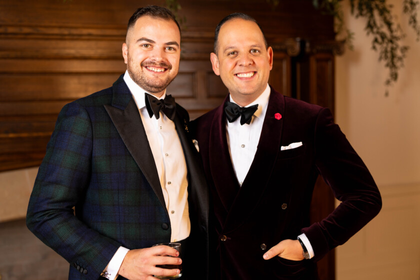 Photo of two men one in a tartan dinner jacket one in velvet dinner jacket