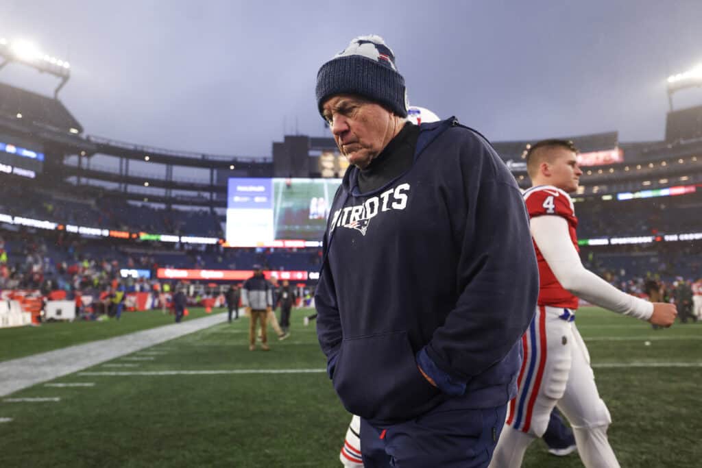 FOXBOROUGH, MASSACHUSETTS - DECEMBER 03: Head coach Bill Belichick of the New England Patriots walks off the field after losing to the Los Angeles Chargers 6-0 at Gillette Stadium on December 03, 2023 in Foxborough, Massachusetts