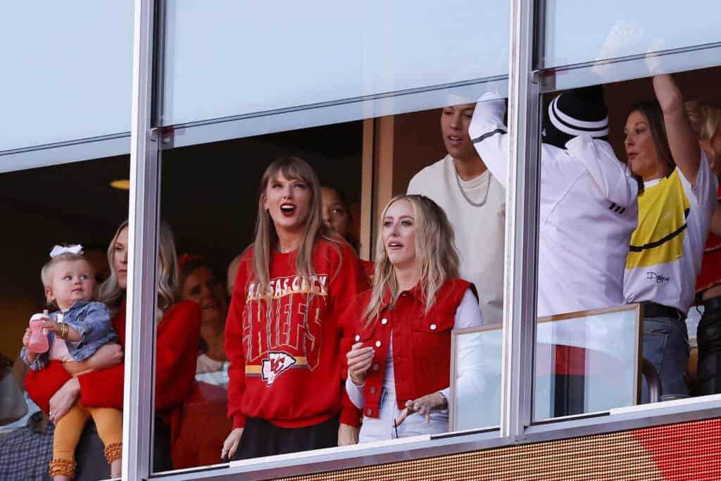 KANSAS CITY, MISSOURI - OCTOBER 22: Taylor Swift and Brittany Mahomes react to a touchdown scored by Travis Kelce #87 of the Kansas City Chiefs during the second quarter of the game against the Los Angeles Chargers at GEHA Field at Arrowhead Stadium on October 22, 2023 in Kansas City, Missouri. 