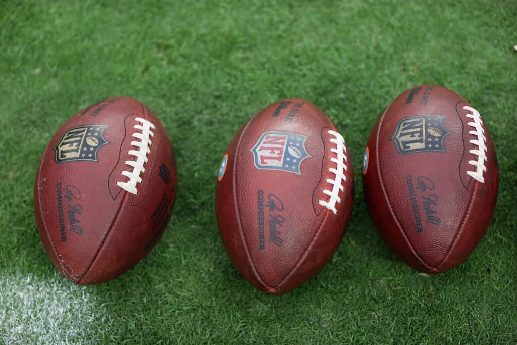 Footballs on the field before the NFL game between the Las Vegas Raiders and the Miami Dolphins at Allegiant Stadium on September 26, 2021 in Las Vegas, Nevada. The Raiders defeated the Dolphins 31-28 in overtime.