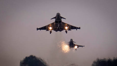 FILE PHOTO: British Royal Air Force Eurofighter Typhoon fighter aircraft fly by at RAF Coningsby in Coningsby, England, May 16, 2023