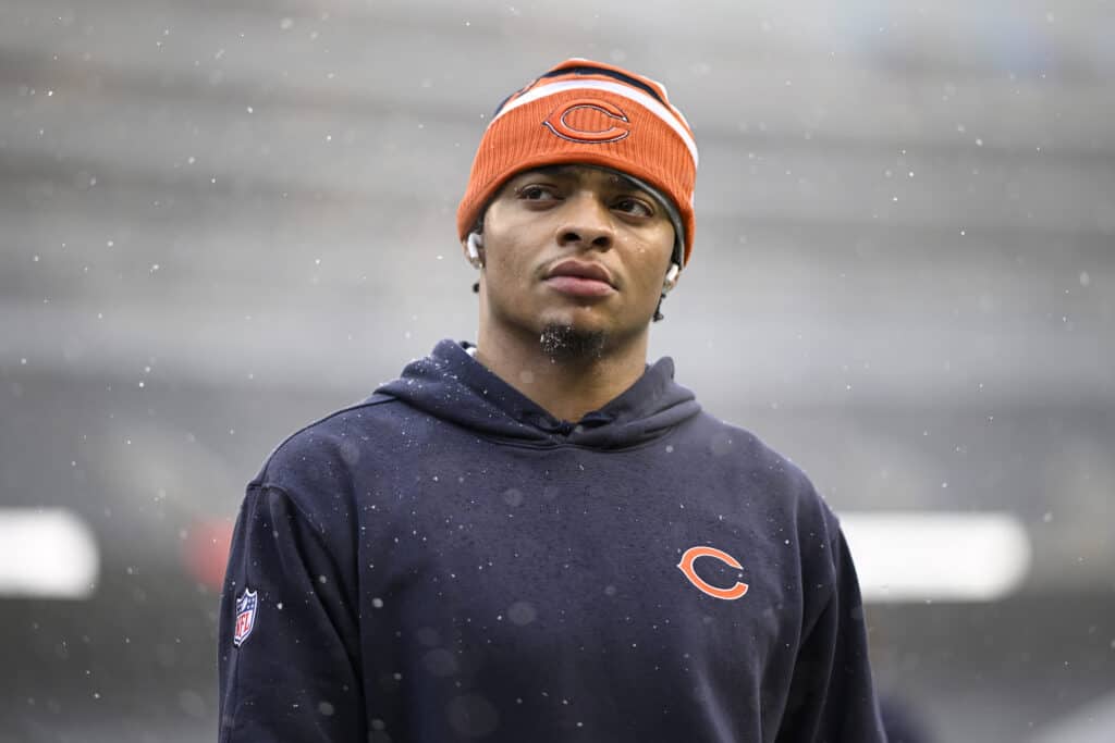 CHICAGO, ILLINOIS - DECEMBER 31: Justin Fields #1 of the Chicago Bears looks on prior to a game against the Atlanta Falcons at Soldier Field on December 31, 2023 in Chicago, Illinois.