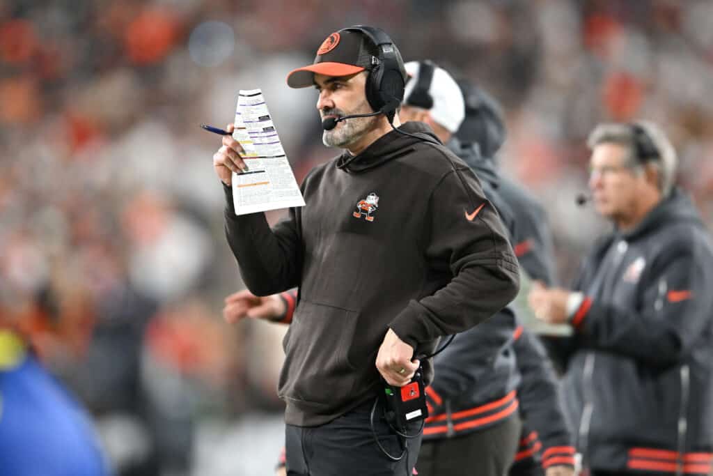 CLEVELAND, OHIO - DECEMBER 28: Head coach Kevin Stefanski of the Cleveland Browns looks at his playbook against the New York Jets at Cleveland Browns Stadium on December 28, 2023 in Cleveland, Ohio. 