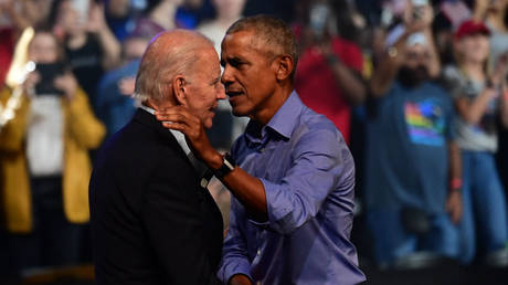 US President Joe Biden and ex-President Barack Obama embrace at a midterm election rally last November in Philadelphia.