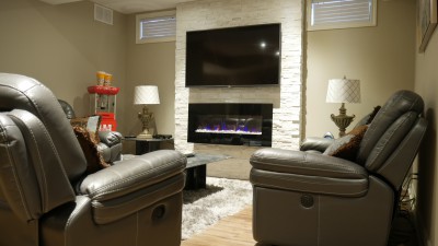 basement with fireplace in milton