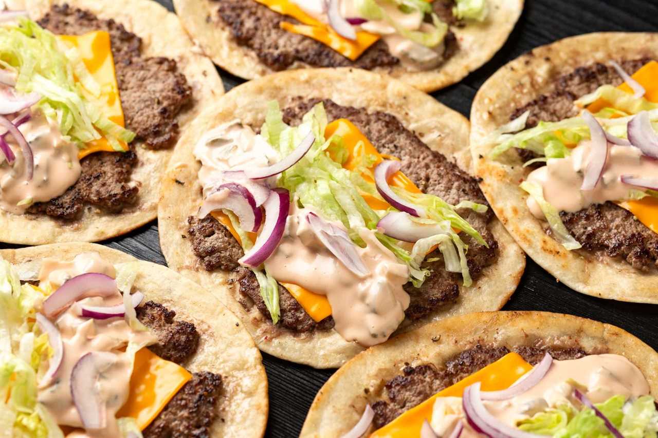 smash burger tacos assembled with toppings