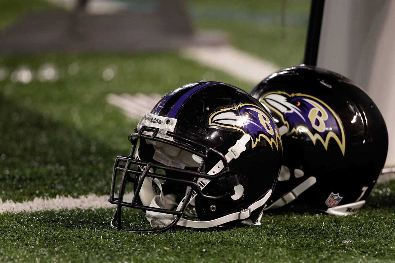 A pair of Baltimore Ravens helmets sit on the sidelines during the Ravens game against the Washington Redskins at M&T Bank Stadium on August 25, 2011 in Baltimore, Maryland.