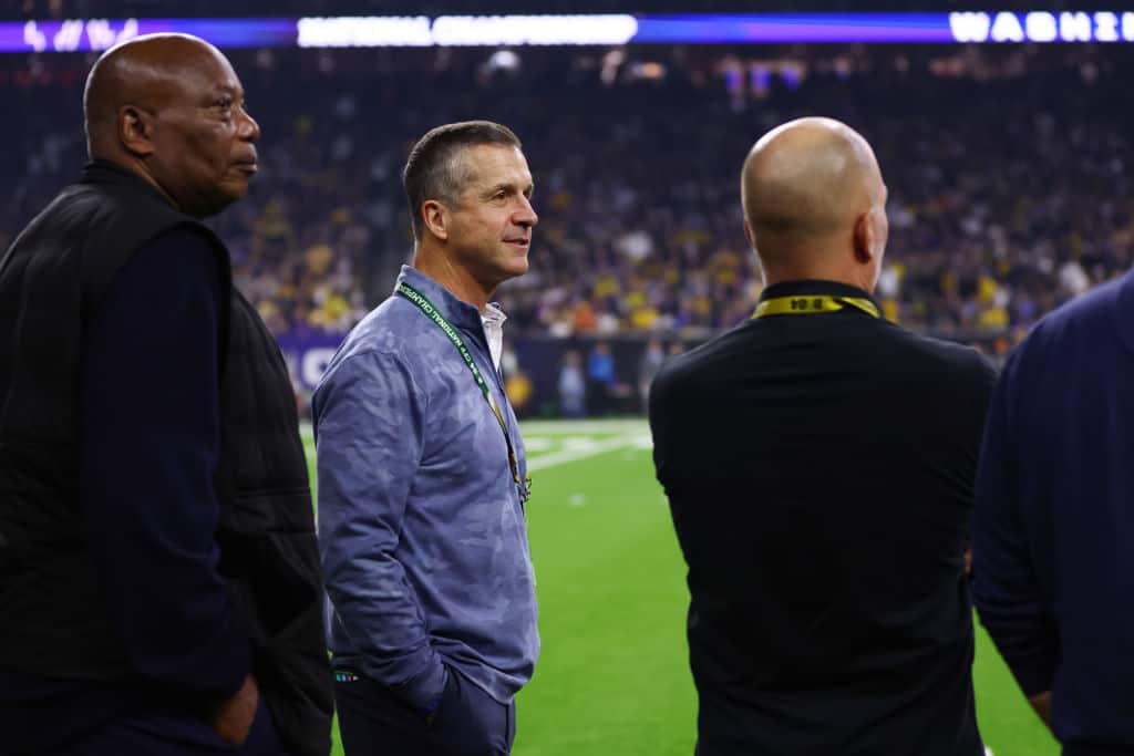 NFL head coach John Harbaugh of the Baltimore Raves reacts during the 2024 CFP National Championship game between the Washington Huskies and Michigan Wolverines at NRG Stadium on January 08, 2024 in Houston, Texas.