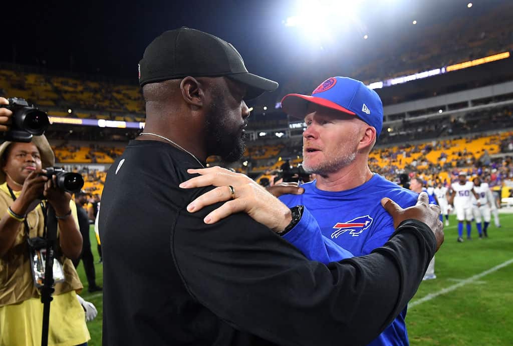 Head coach Mike Tomlin of the Pittsburgh Steelers talks with head coach Sean McDermott of the Buffalo Bills after a 27-15 Steelers win during a preseason game at Acrisure Stadium on August 19, 2023 in Pittsburgh, Pennsylvania.