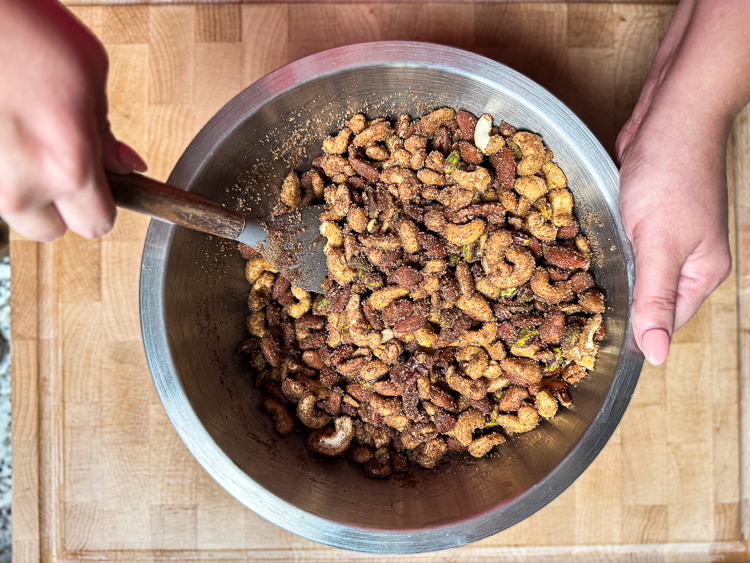 candied nuts with cinnamon sugar in a metal bowl