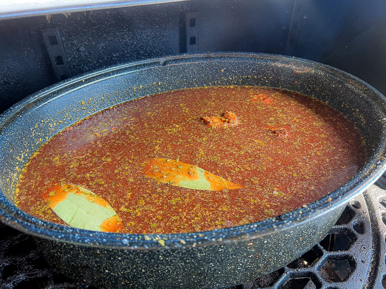 pot with all the ingredients in the smoker