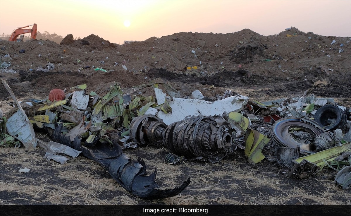 Parts of an engine and landing gear lie in a pile at the crash site of Ethiopian Airlines Flight 302 in Bishoftu, Ethiopia. 