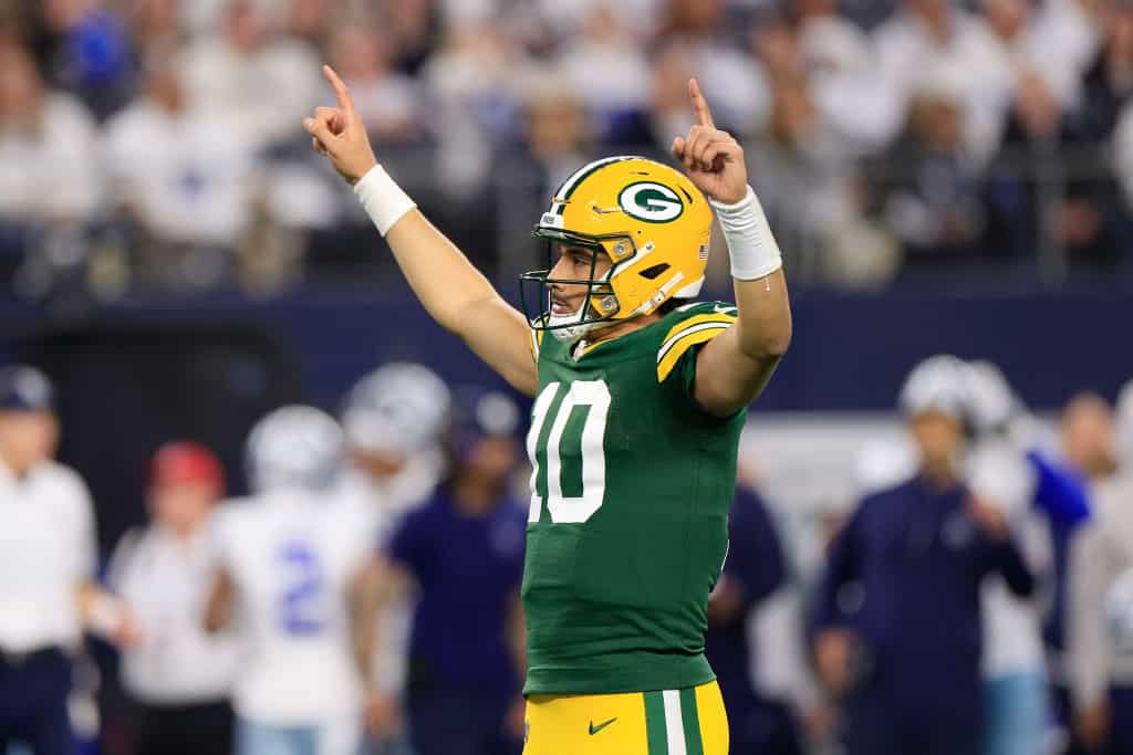 Jordan Love #10 of the Green Bay Packers celebrates a touchdown against the Dallas Cowboys during the third quarter of the NFC Wild Card Playoff game at AT&T Stadium on January 14, 2024 in Arlington, Texas. 