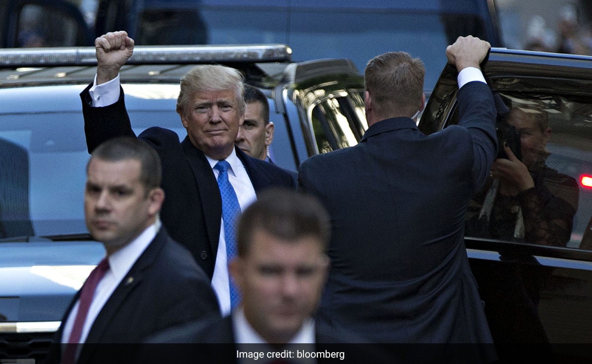 Donald Trump gestures outside a polling station after voting in the presidential election in New York, on Nov. 8, 2016