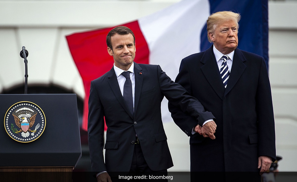 Macron shakes hands with Trump at an arrival ceremony during a state visit to Washington, in April 2018.