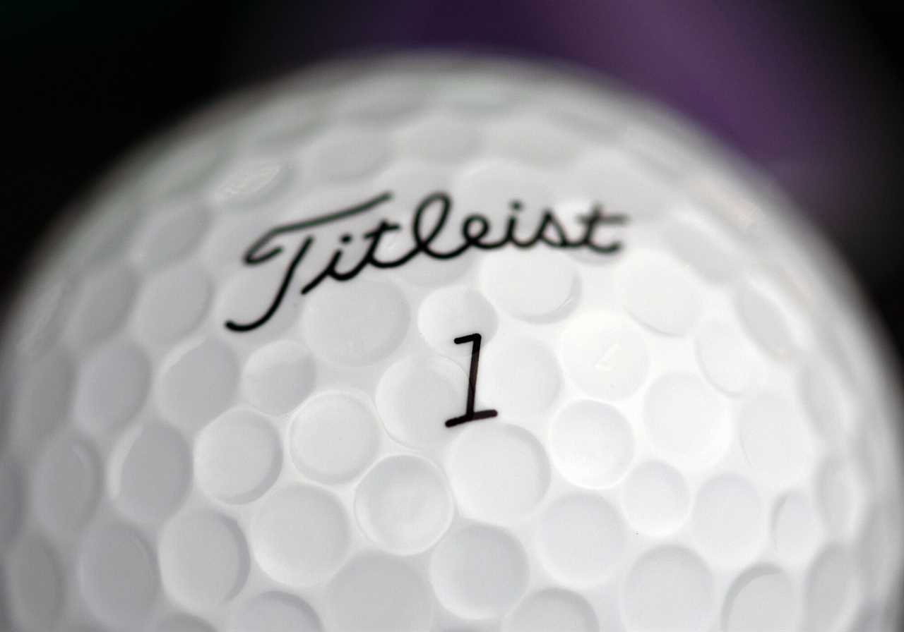 a closeup of the player number on a Titleist AVX golf ball