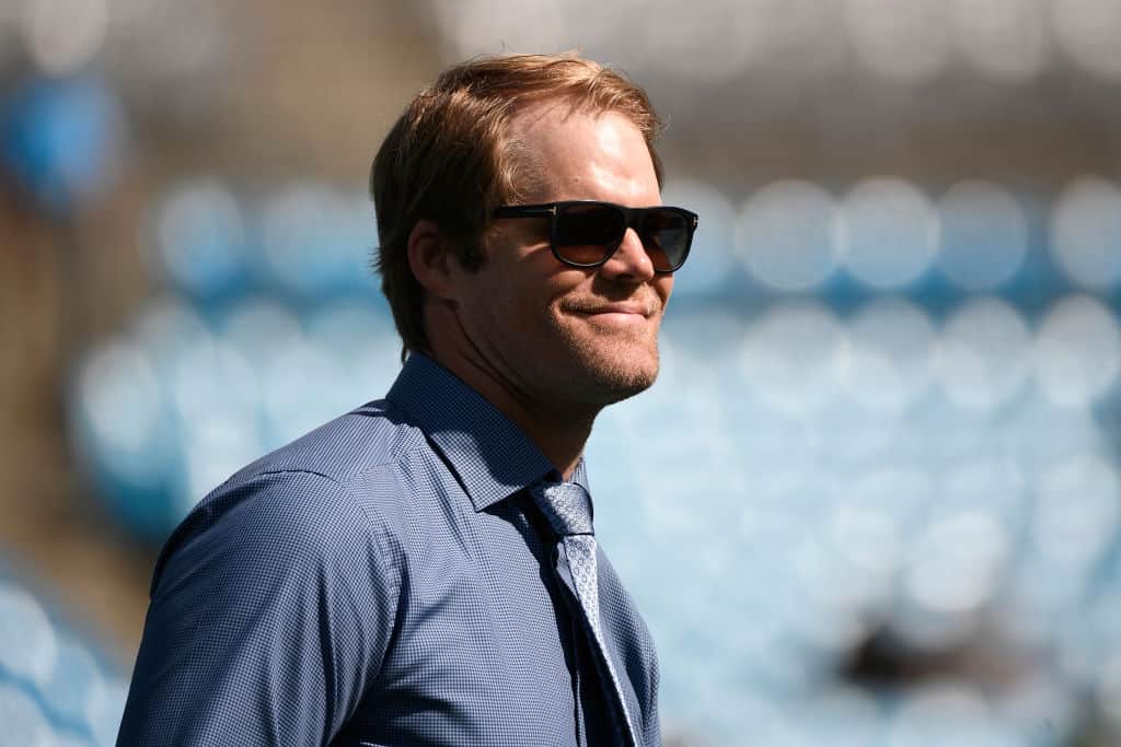 Former player Greg Olsen of the Carolina Panthers reacts during the football game against the Philadelphia Eagles at Bank of America Stadium on October 10, 2021 in Charlotte, North Carolina.