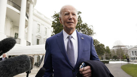 Joe Biden speaks to the media before departing the White House in Washington DC, January 18, 2024