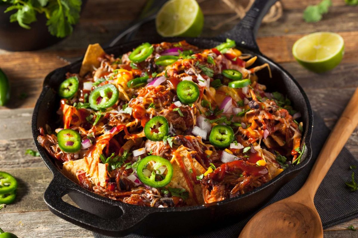 Pulled pork nachos in skillet