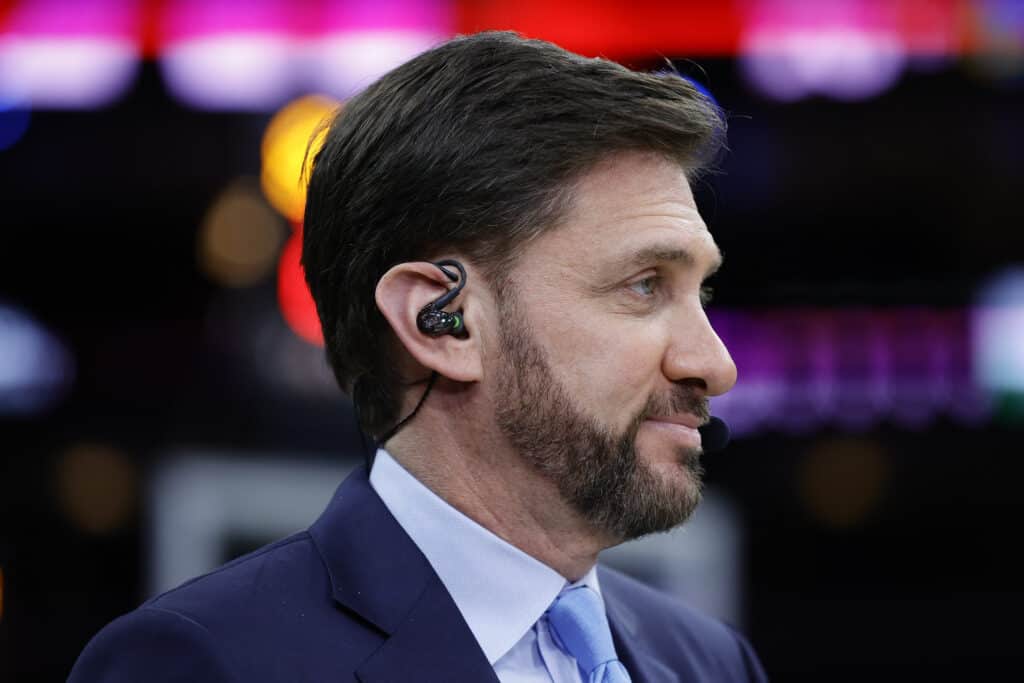 Mike Greenberg of ESPN looks on during a game between the Philadelphia 76ers and the Golden State Warriors at Wells Fargo Center on December 11, 2021 in Philadelphia, Pennsylvania. NOTE TO USER: User expressly acknowledges and agrees that, by downloading and or using this photograph, User is consenting to the terms and conditions of the Getty Images License Agreement.