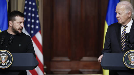 Ukrainian President Vladimir Zelensky (L) and U.S. President Joe Biden hold a news conference in the Indian Treaty Room of the Eisenhower Executive Office Building on December 12, 2023 in Washington, DC