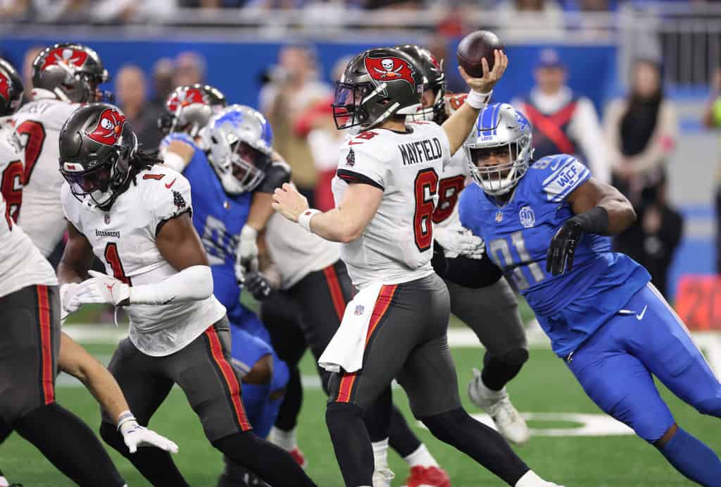 Baker Mayfield #6 of the Tampa Bay Buccaneers plays against the Detroit Lions during a NFC Divisional Playoff game at Ford Field on January 21, 2024 in Detroit, Michigan.