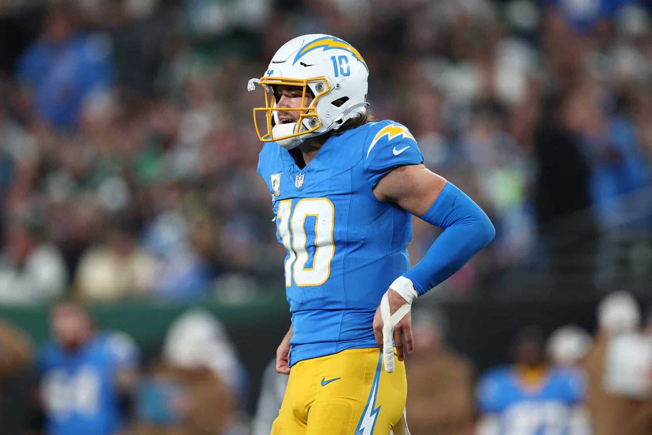 Justin Herbert #10 of the Los Angeles Chargers reacts during the second half against the New York Jets at MetLife Stadium on November 06, 2023 in East Rutherford, New Jersey.