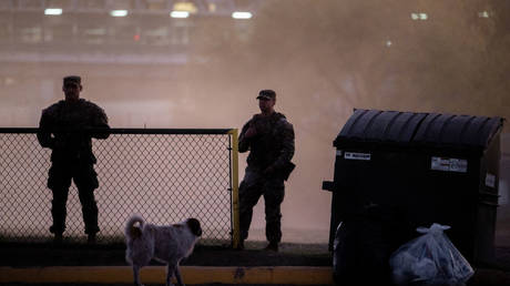 Texas National Guard troops stand guard at Shelby Park, located on the US-Mexico border, earlier this month in Eagle Pass, Texas.