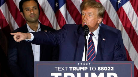 Republican presidential hopeful and former US President Donald Trump gestures as he speaks during an Election Night Party in Nashua, New Hampshire, on January 23, 2024.