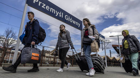 FILE PHOTO. Refugees from Ukraine are seen walking on the platform upon their arrival by train from Odessa at the railway station in Przemysl, southeastern Poland.