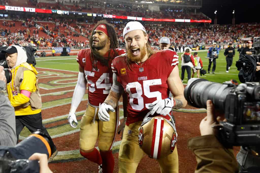 Fred Warner #54 and George Kittle #85 of the San Francisco 49ers leave the field after the 49ers defeated the Green Bay Packers 24-21 in the NFC Divisional Playoffs at Levi's Stadium on January 20, 2024 in Santa Clara, California.